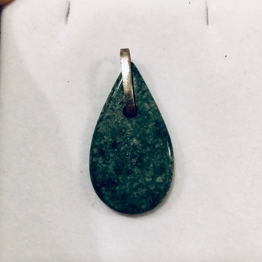 Handmade Guatemalan jade pendant. On silver hook